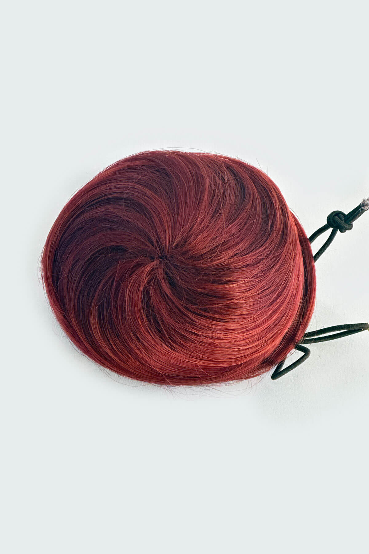 Red hair bun on a white background. Hairpiece bun; instant perfect bun hairpiece: Hepburn red 39