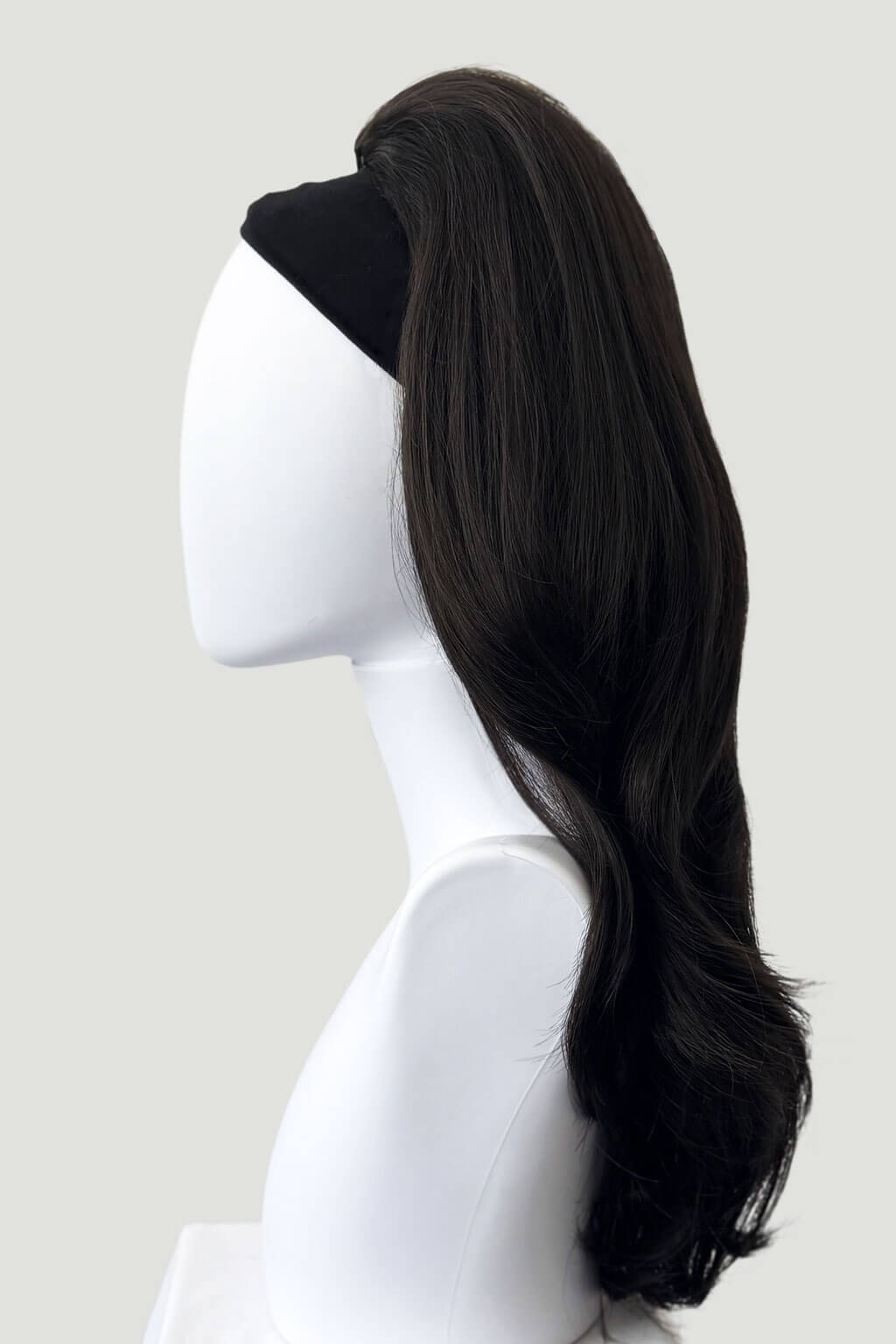 Dark brown hair extension on a mannequin head against a white background. 1960s style hair, high crown long straight and layered half wig: Juliette dark brown 4