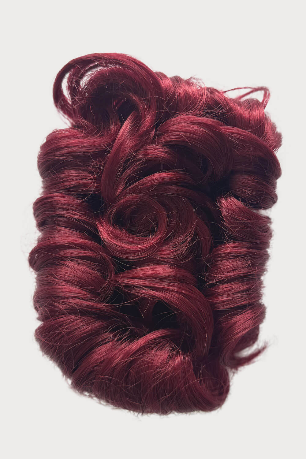 Red hair bun accessory on a white background. Hair poodle clip-in hairpiece bun vintage style 1950s: Lucille cherry red 39