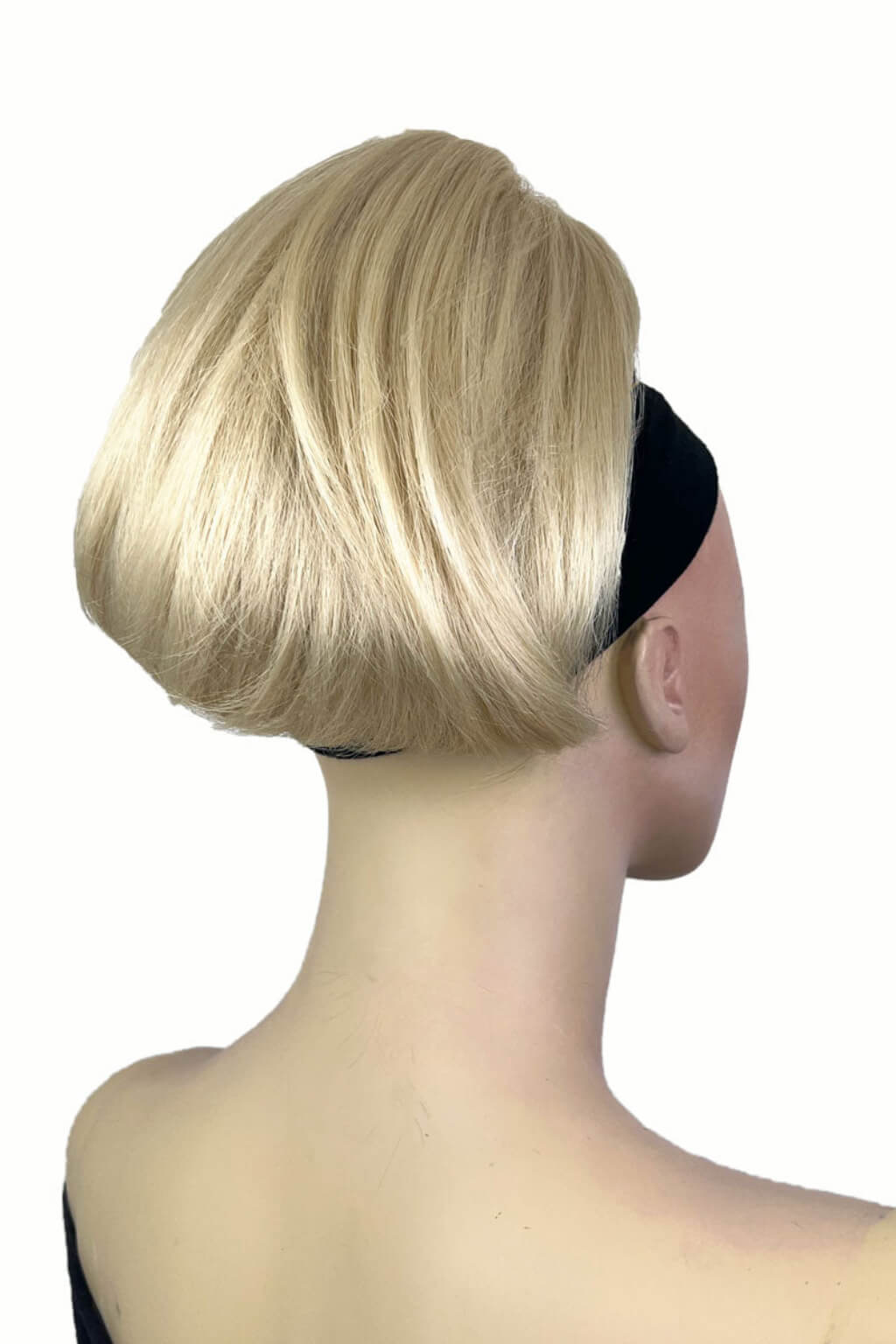 A woman showcasing a short ponytail extension hairpiece in a straight, full, and bouncy style. Short ponytail extension hairpiece, straight, full & bouncy: Tanaya blonde 613