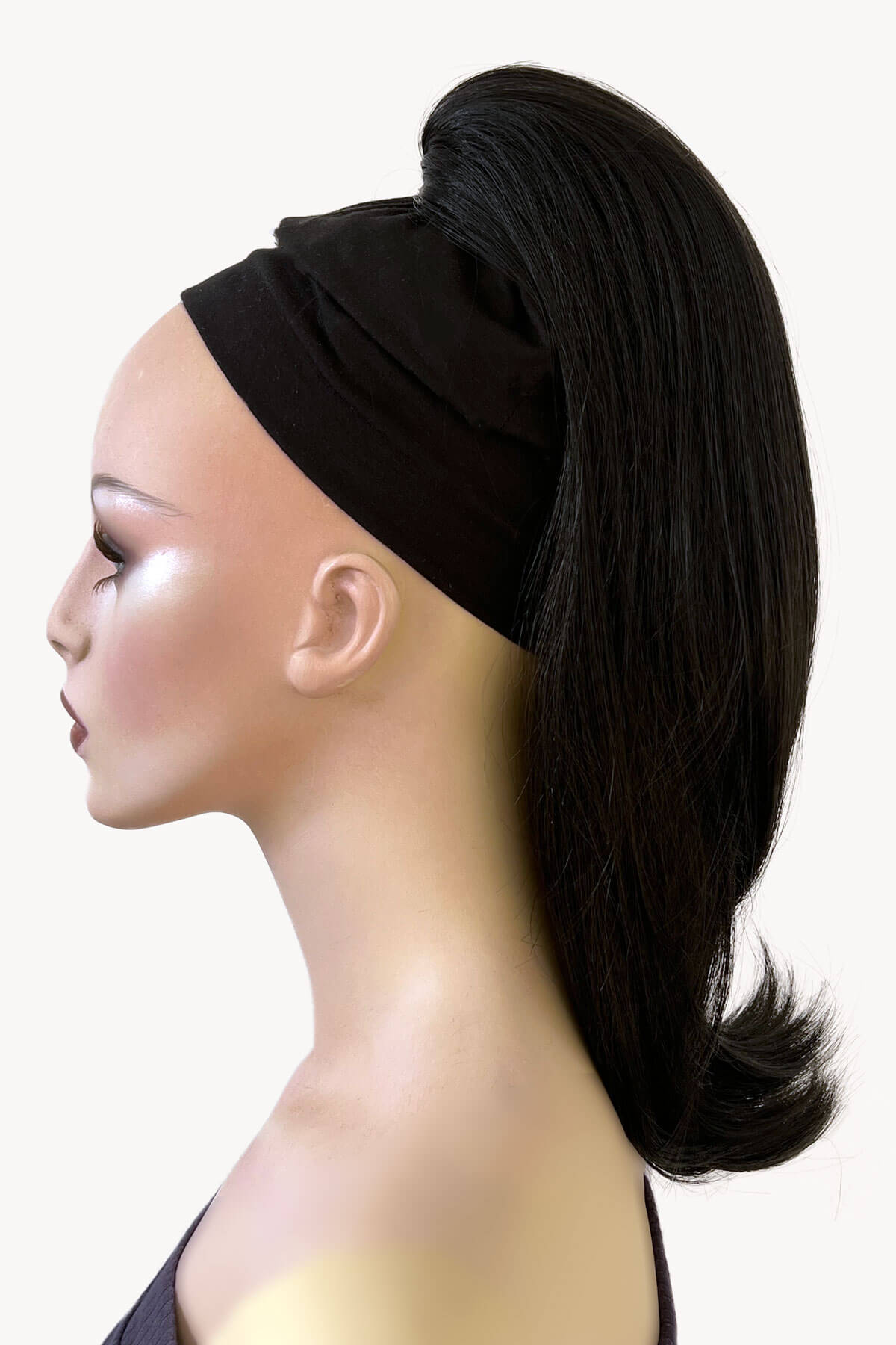 Mannequin head with black hair styled in a ponytail and headband on a white background. Long ponytail hairpiece, straight with flick: Clarisa black 1B