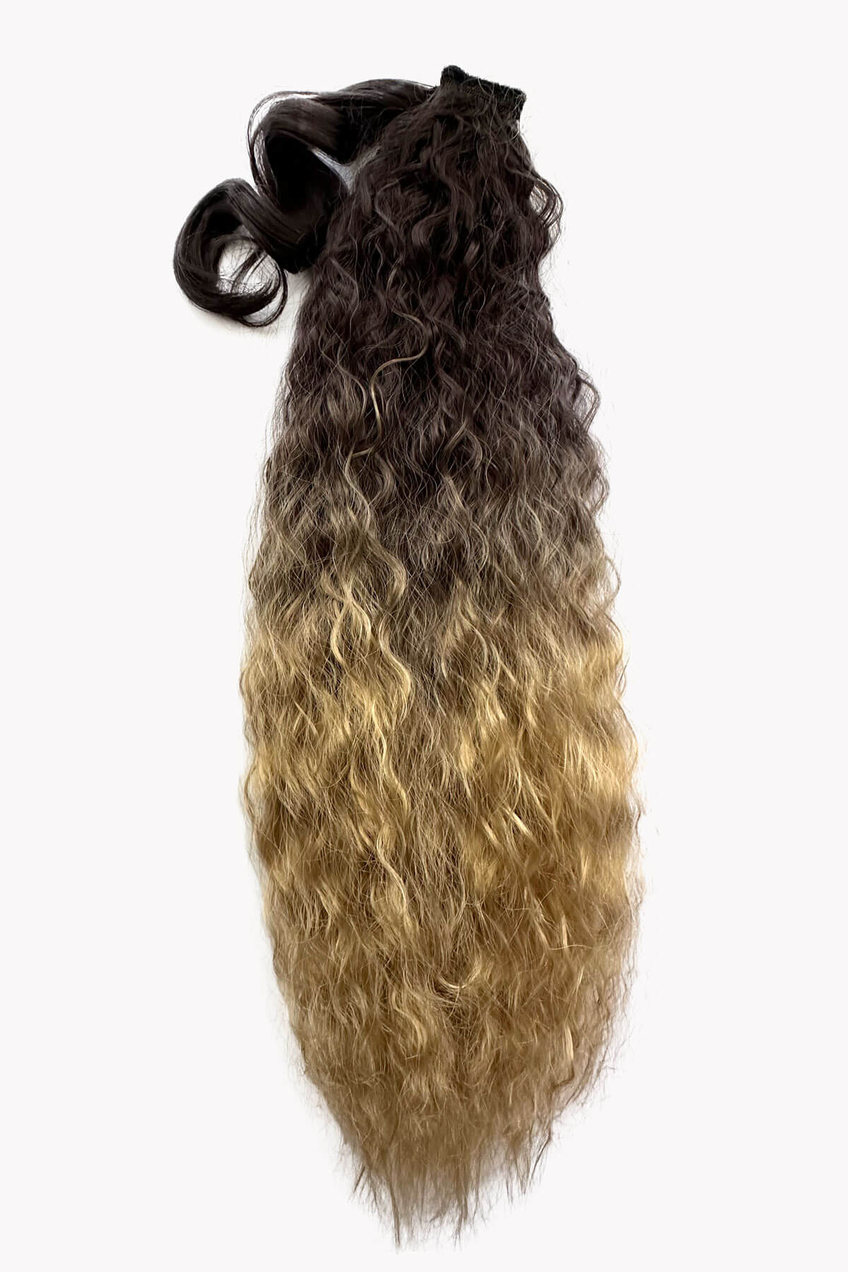 Hair extension with gradient color from black to blonde on a white background. Extra long ponytail extension with long loose spirals: Kaia brown to blonde ombre blend 4TN27