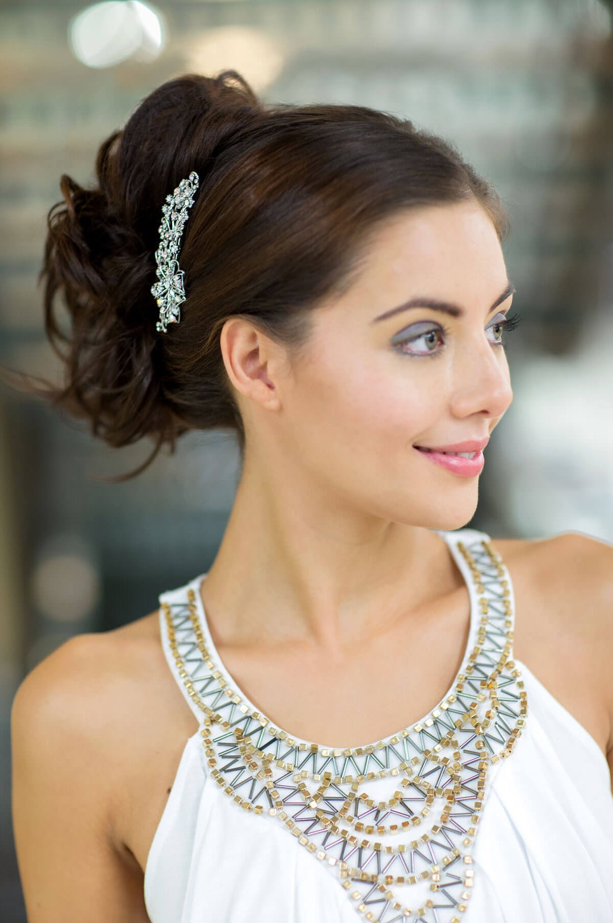 Woman with elegant hairpiece and white dress with intricate neckline. Clip in hairpiece, ponytail, short, flexihair: Leela chestnut brown 8