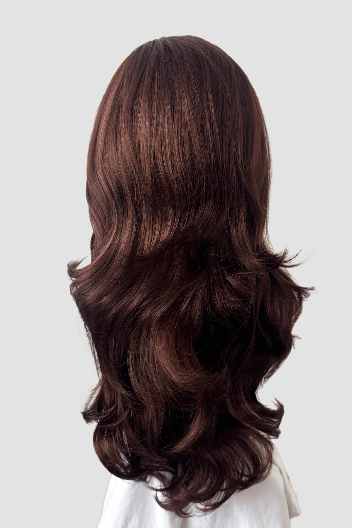 Mannequin head with long brown wig on a white background. Anne - Super Full Volume Long Loose Curls Reddish Brown Half Wig