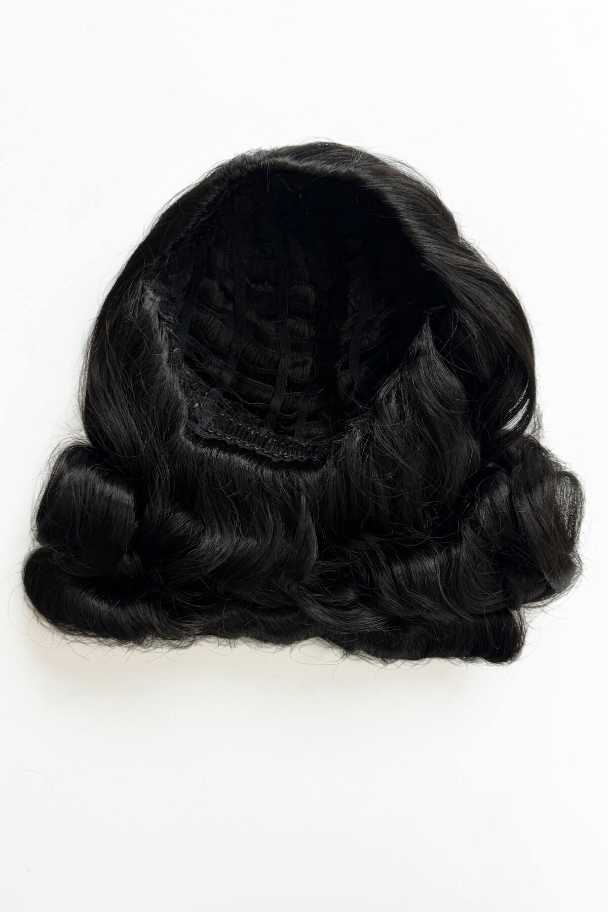 Black wig on a white background. 1950s style half wig hairpiece with deep finger waves: Deborah black 1B