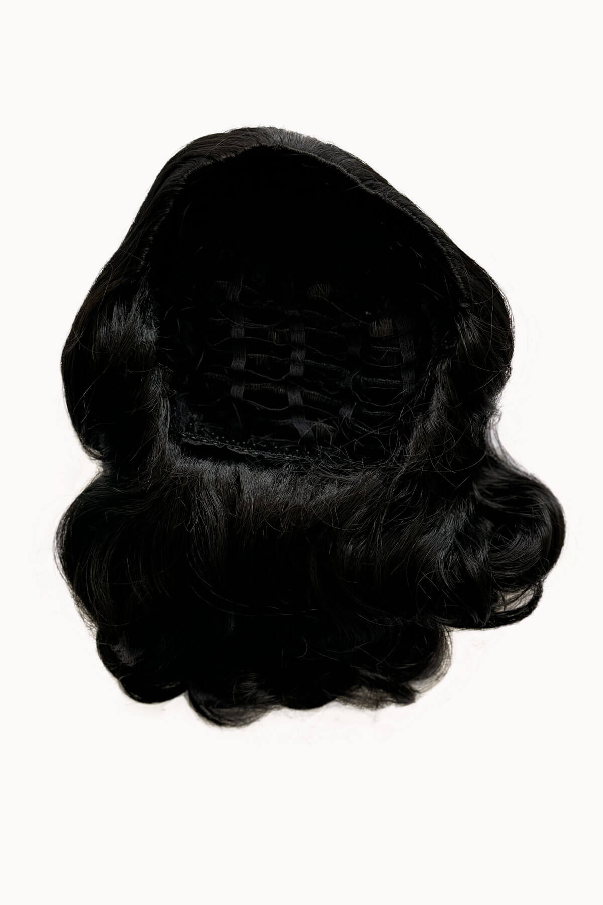 Black wig on a white background. 1950s style shoulder length half wig hairpiece with beautiful vintage waves: Onyx colour black 1B