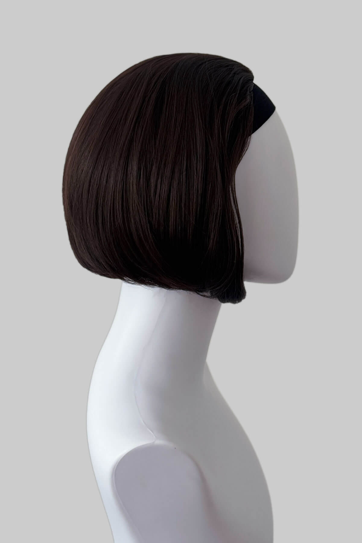 Dark brown bob half wig on a mannequin head against a plain background. Bob half wig hairpiece, Flexihair: Amelie chocolate brown 6