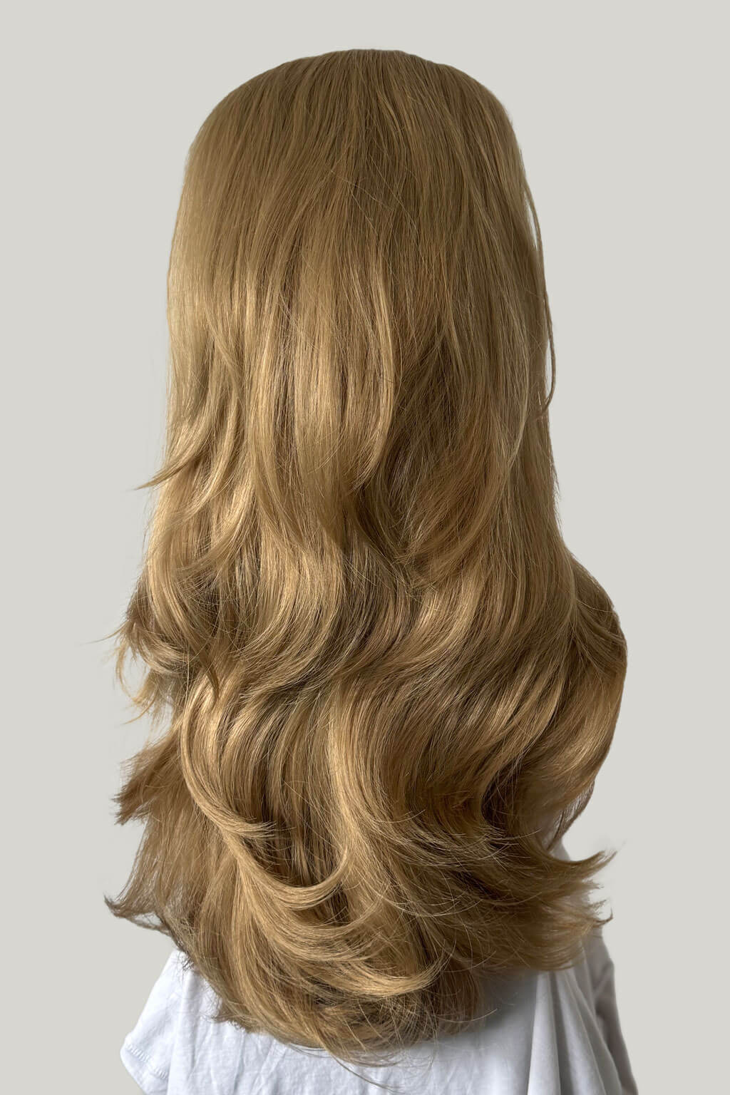 Blonde wig on a mannequin head against a plain background - Blonde wig on a mannequin head against a plain background - High crown long, layered half wig and volume ring: Helena ash blonde 24