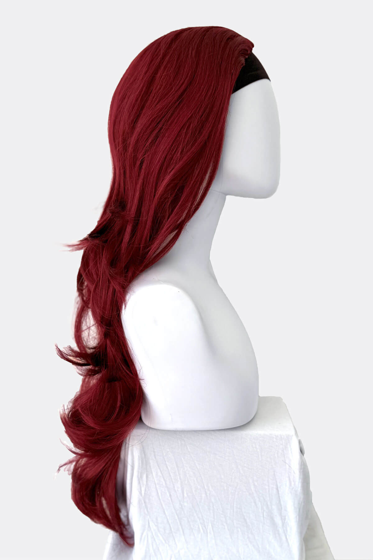 Red wig on a mannequin head against a white background. Red half wig hairpiece (3/4 wig), gentle curls: Ivy copper red and wine red 350-39