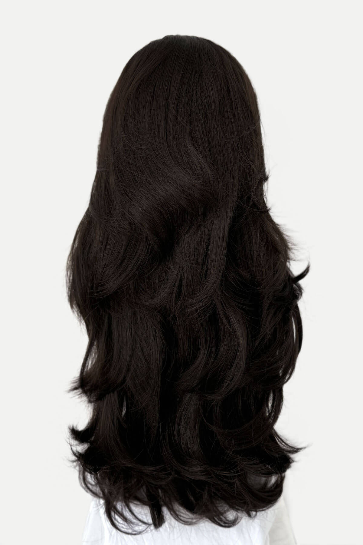 Black wig with wavy hair on a white background. Brown half wig hairpiece (3/4 wig), layered, wavy: Simone dark brown 6