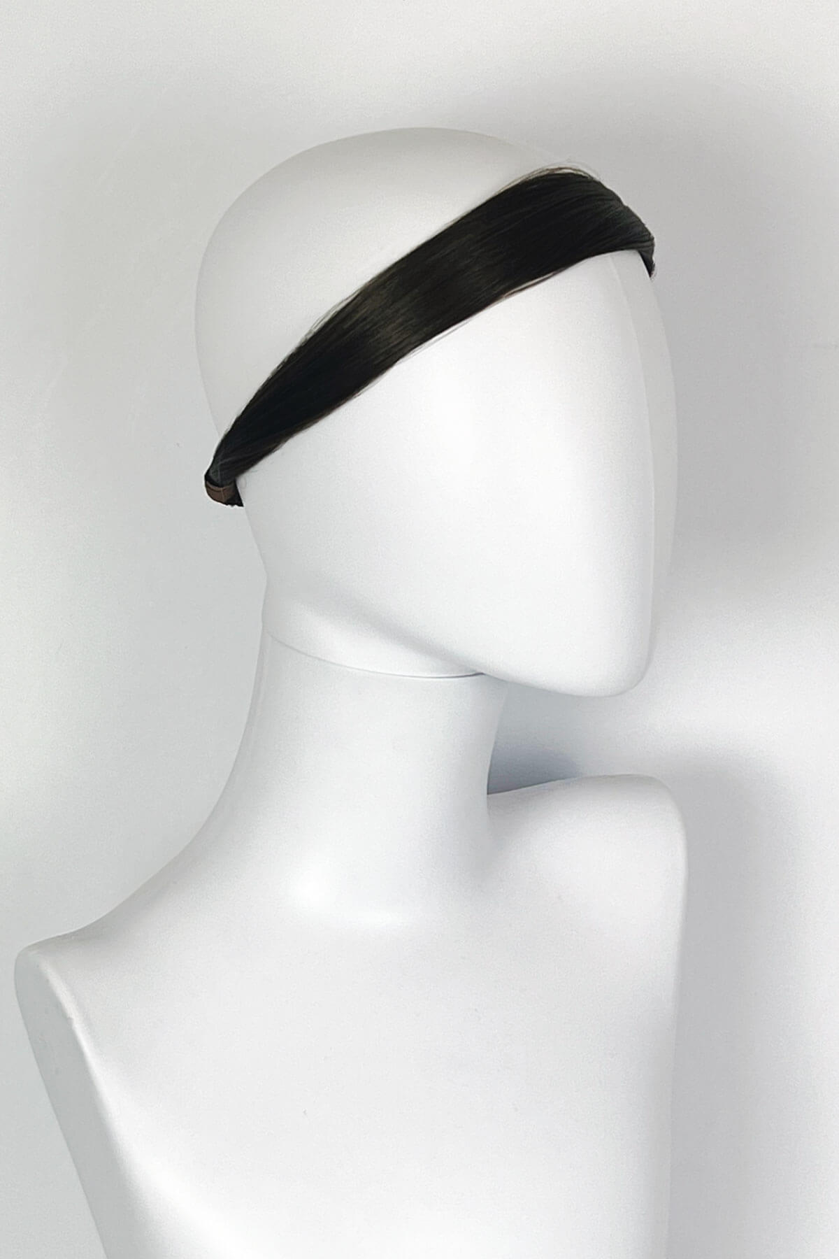 Black headband on a mannequin head against a white background. Loose hair hairband: Mabel dark chocolate brown 6