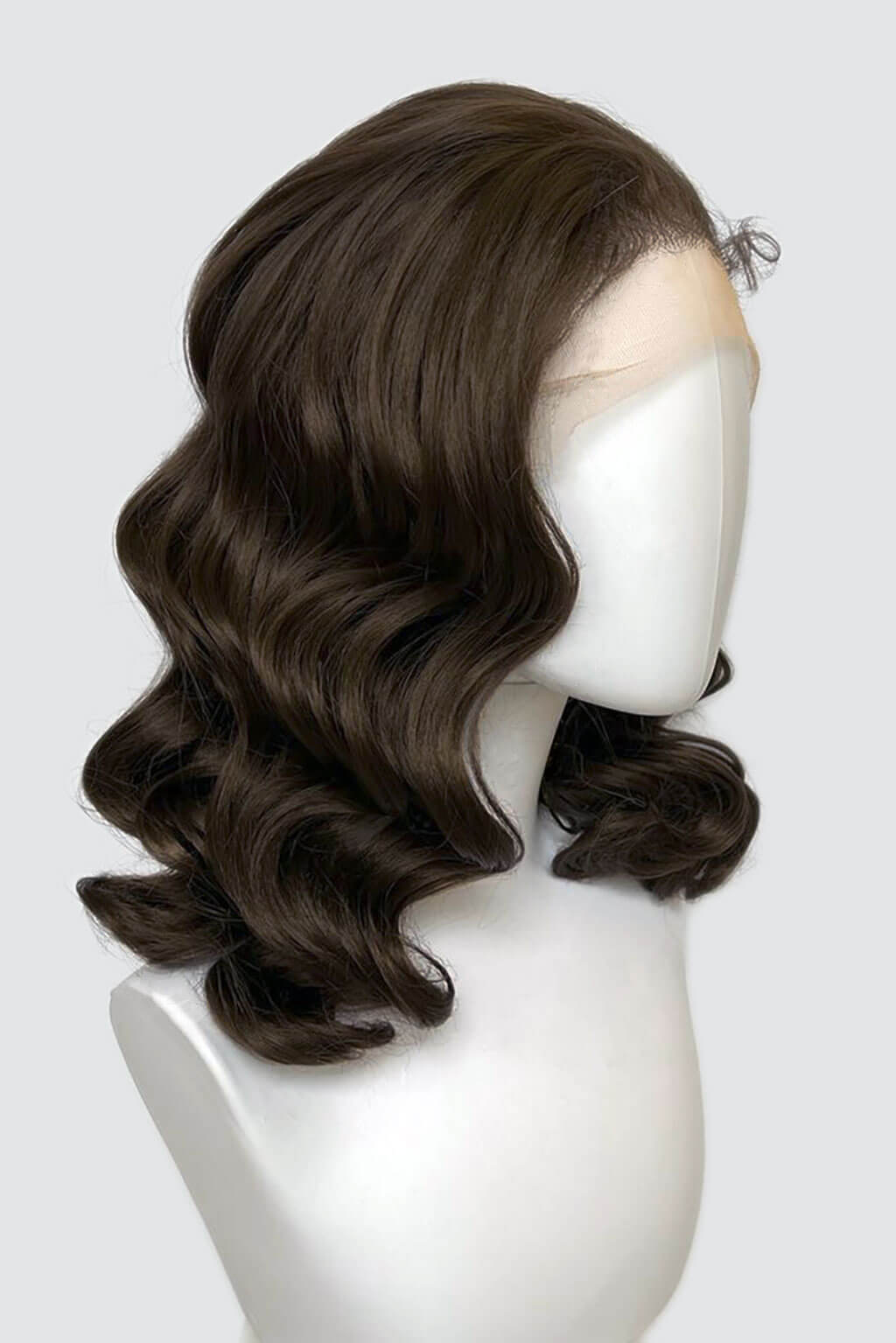 Brown wavy wig on a white mannequin head against a white background. Brown pinup wig, lace front with finger waves: Nikita dark chocolate brown 6