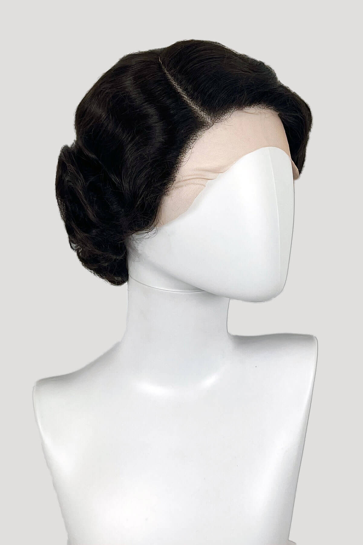 Dark brown wig on a mannequin head against a white background. Dark brown lacefront wig, pinup/vintage style, short with finger waves: Dixie