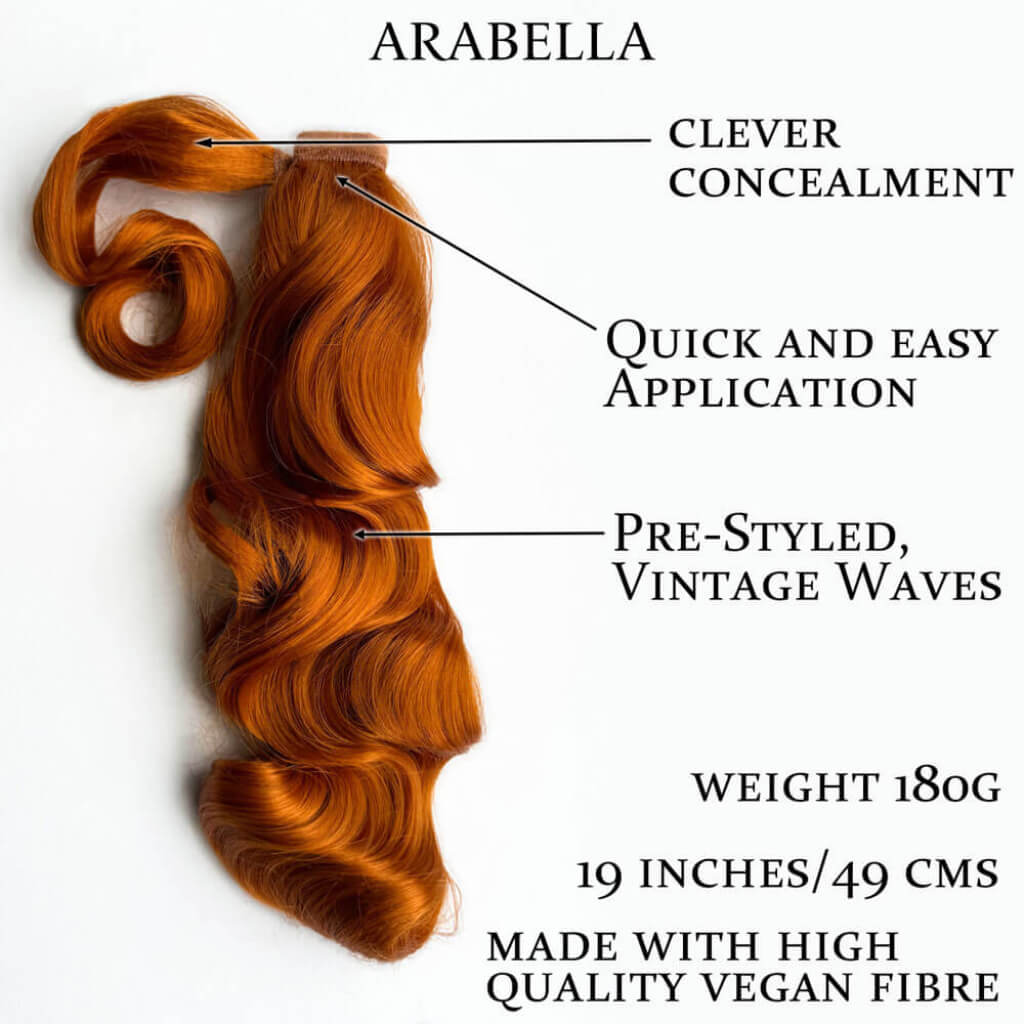 A styled hair extension sample labeled 'ARABELLA' on a white background with callout text describing concealment, easy application, vintage waves, weight 180g, 19 inches/49 cm, and vegan fibre. Retro style ponytail hairpiece, long with vintage waves: Arabella ginger