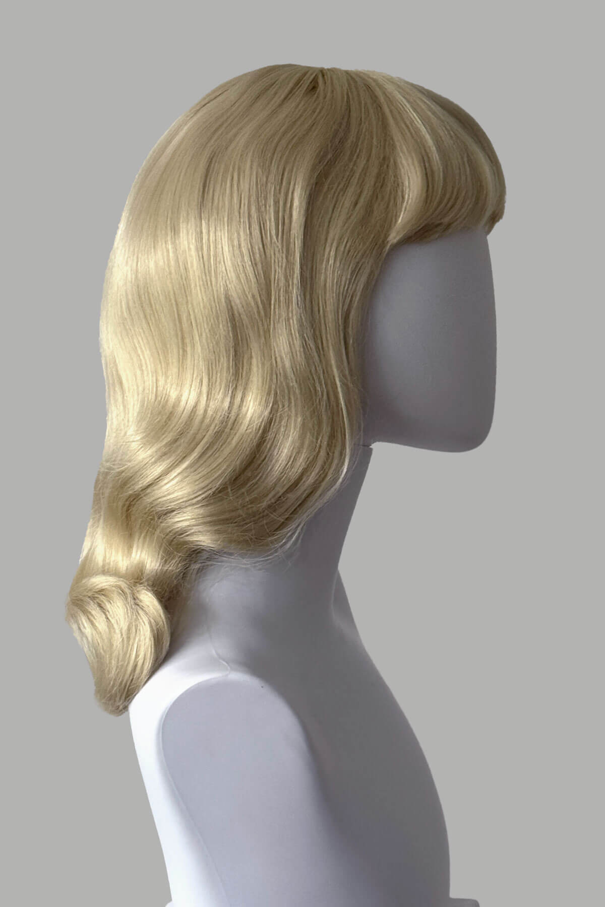 Blonde pinup wig with long finger waves and a short fringe: Cora champagne blonde 613