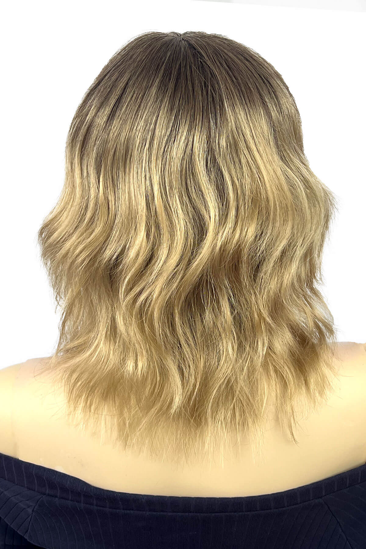 A wavy shoulder-length bob wig with a dark brown root colour and warm blonde highlights, shown from the back on a mannequin or model against a white background. Long dark brown bob wig (LOB) with textured waves: Anais 8TN24