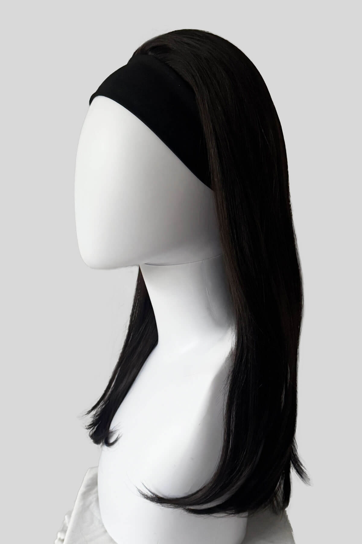 A close-up of a dark brown headband half wig hairpiece showing the texture of the hair against a white background. Headband half wig hairpiece, long and straight: Isla dark brown 4