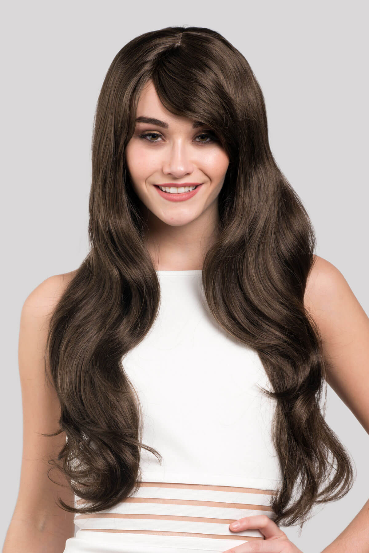 Woman with long brown wig on a plain background. Long brown wig with loose waves: Mandy chestnut brown 8