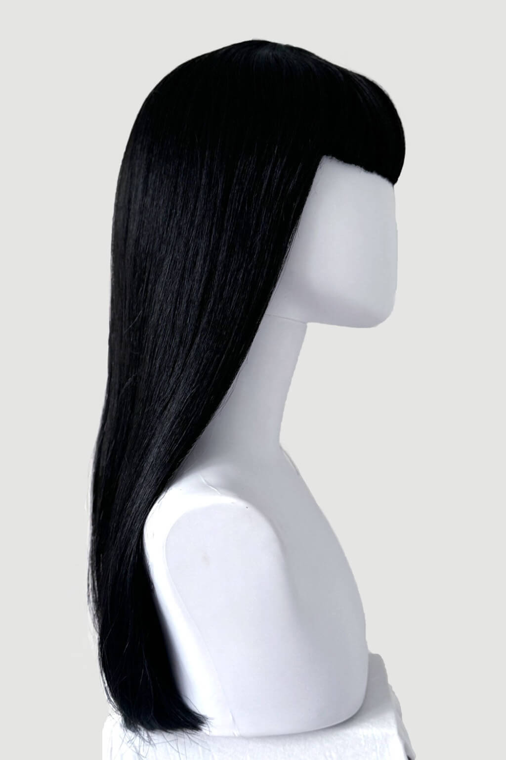 A long, straight black wig with a straight bang, displayed on a white mannequin head and neck against a light grey background. Long black wig with straight hair and a short, straight fringe: Maxine