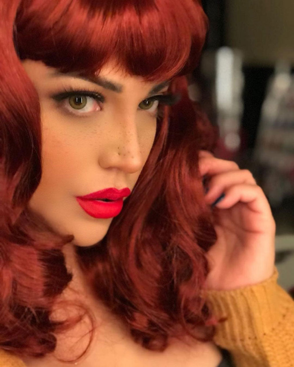 Copper red 1950s pinup wig, curled with short fringe: Kitty