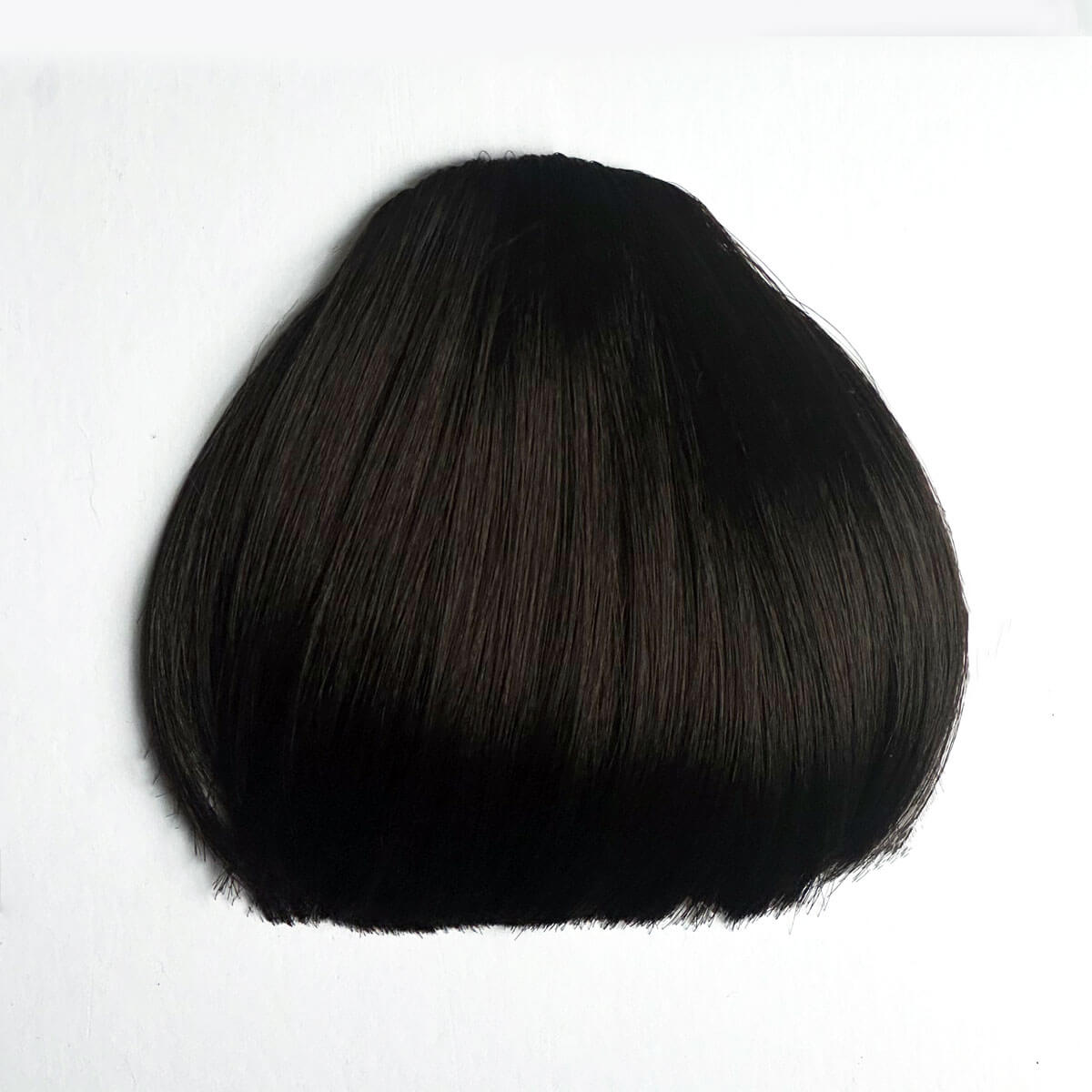 Dark brown fringe hairpiece on a white background
