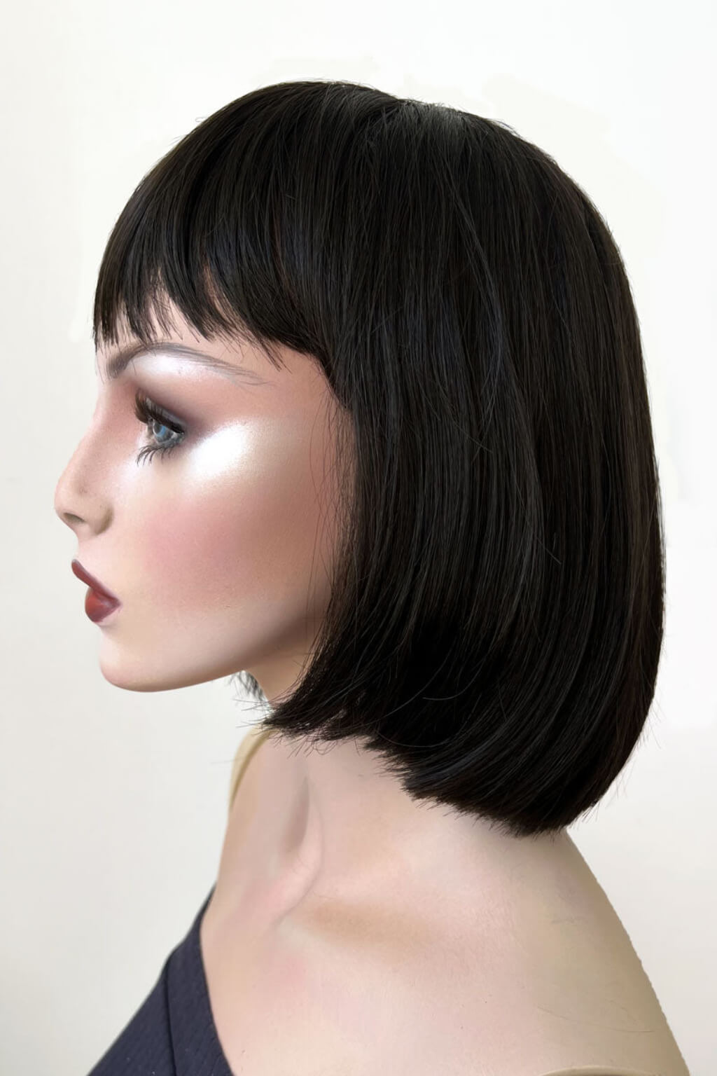 Mannequin head with black bob haircut on a white background. Brown bob wig, chic and stylish: Honour dark brown 4