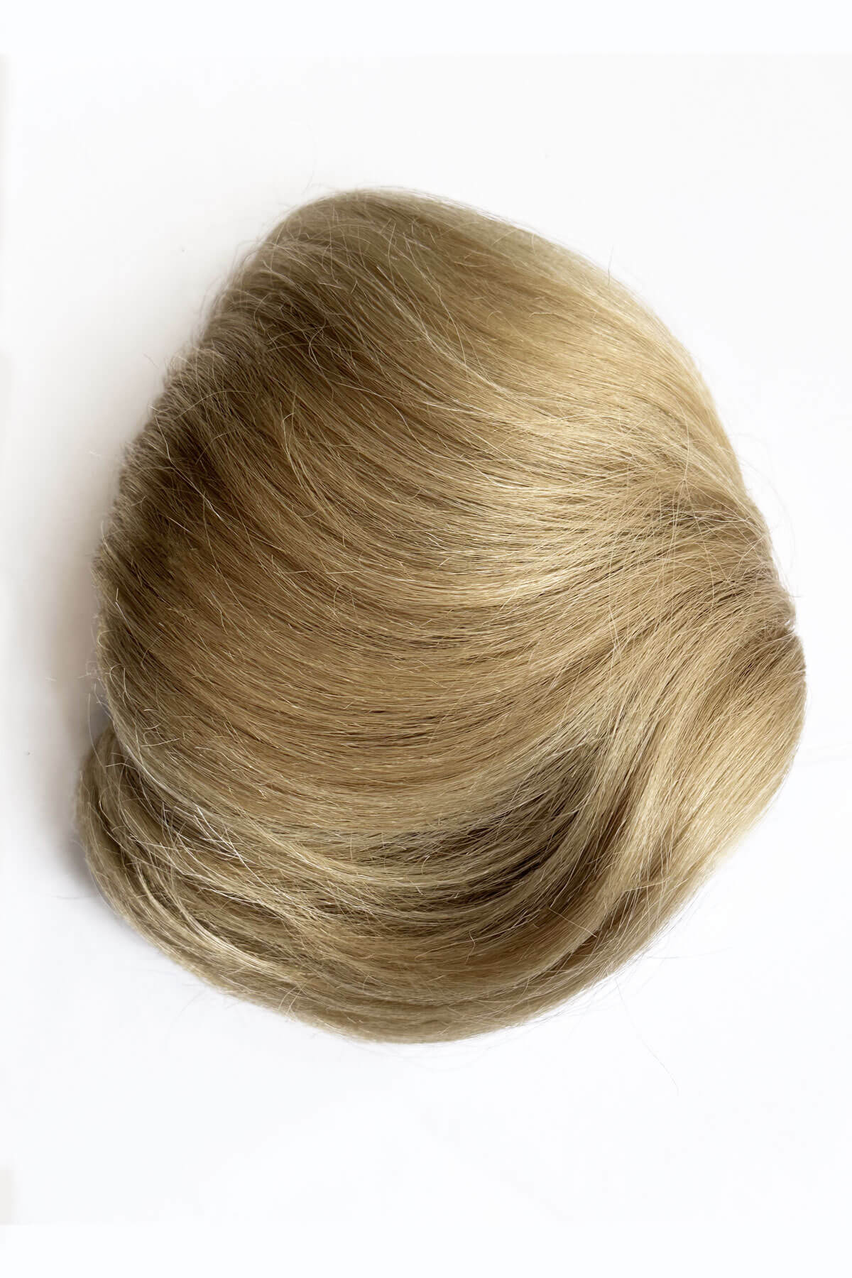 Blonde hairpiece on a white background. Beehive hairpiece hair height booster, Flexihair: Pixi blonde 24H613