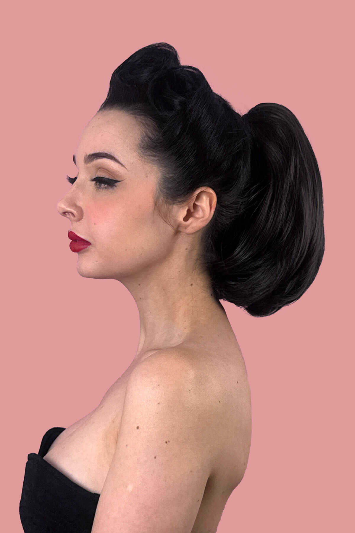 Woman with short ponytail extension hairpiece, straight, full & bouncy: Tanaya black 1B