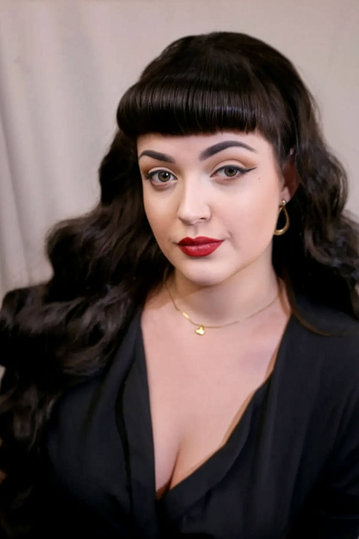 Woman with long, wavy brown hair and makeup wearing a black top against a neutral background. Ultra long half wig with hollywood waves. chestnut brown 8