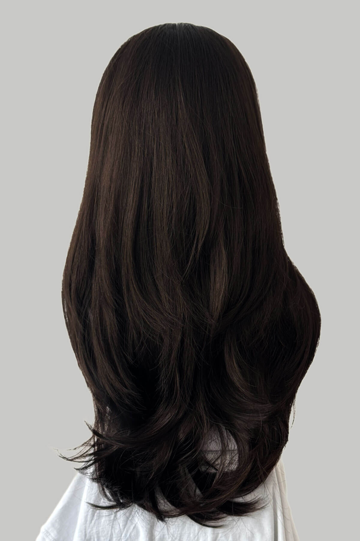 Dark brown wig on a plain background. ong brown hair on a plain background. Brown half wig hairpiece, layered and straight: Summer dark chocolate brown 6