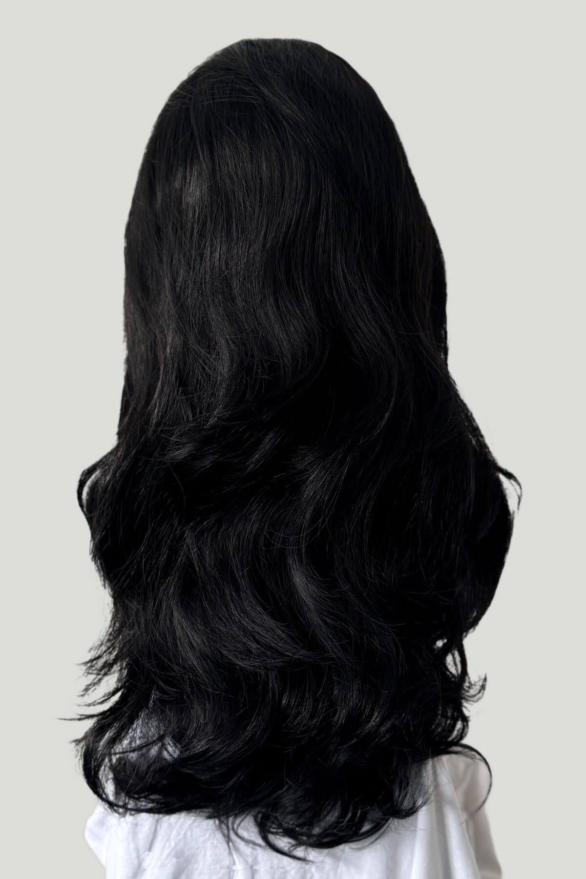 Black wig on a white background.  Black 3/4 hairpiece (half wig) with long waves: Jessie black 1b