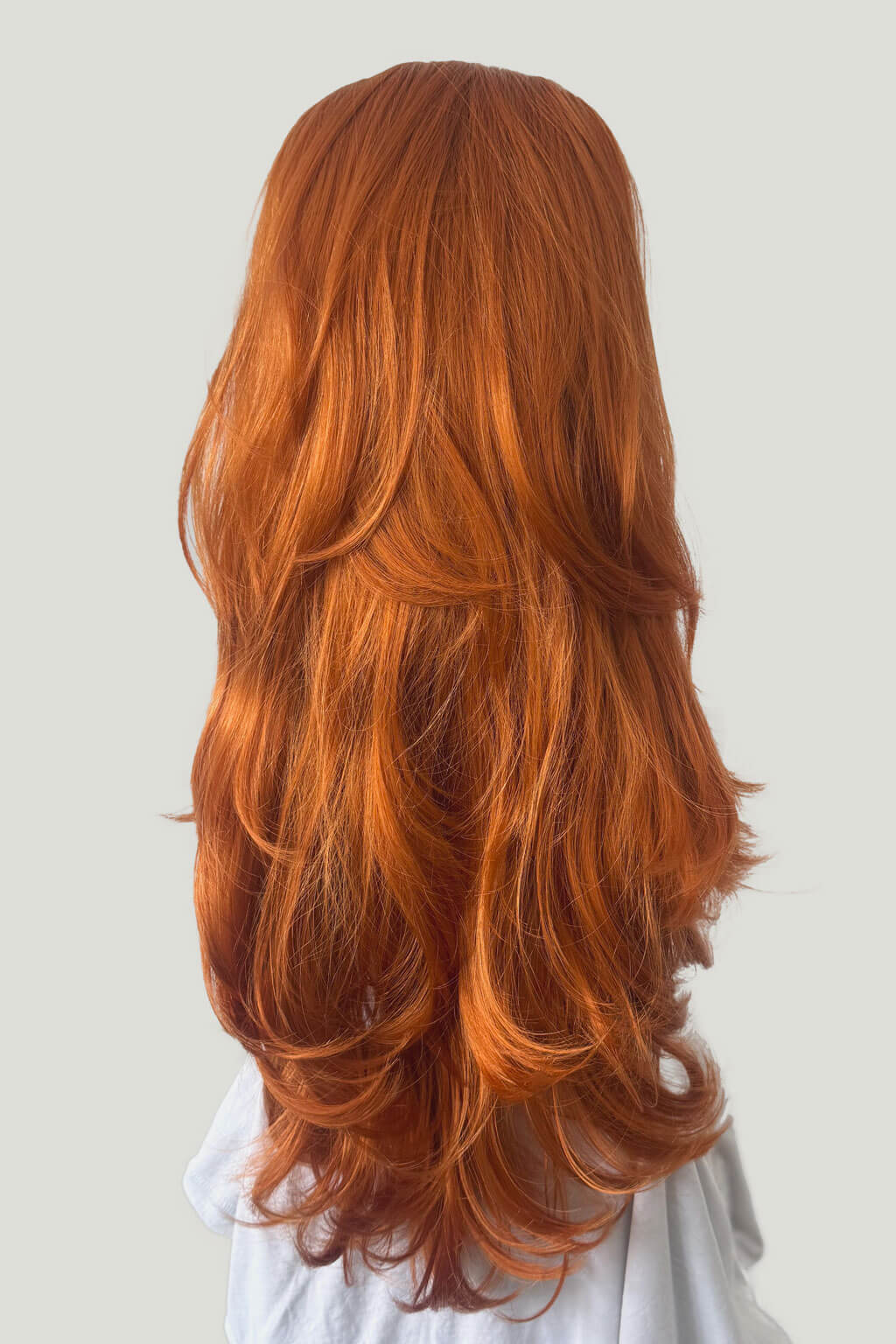 Long, wavy red hair on a plain background -  High crown long, layered half wig and volume ring: Helena ginger