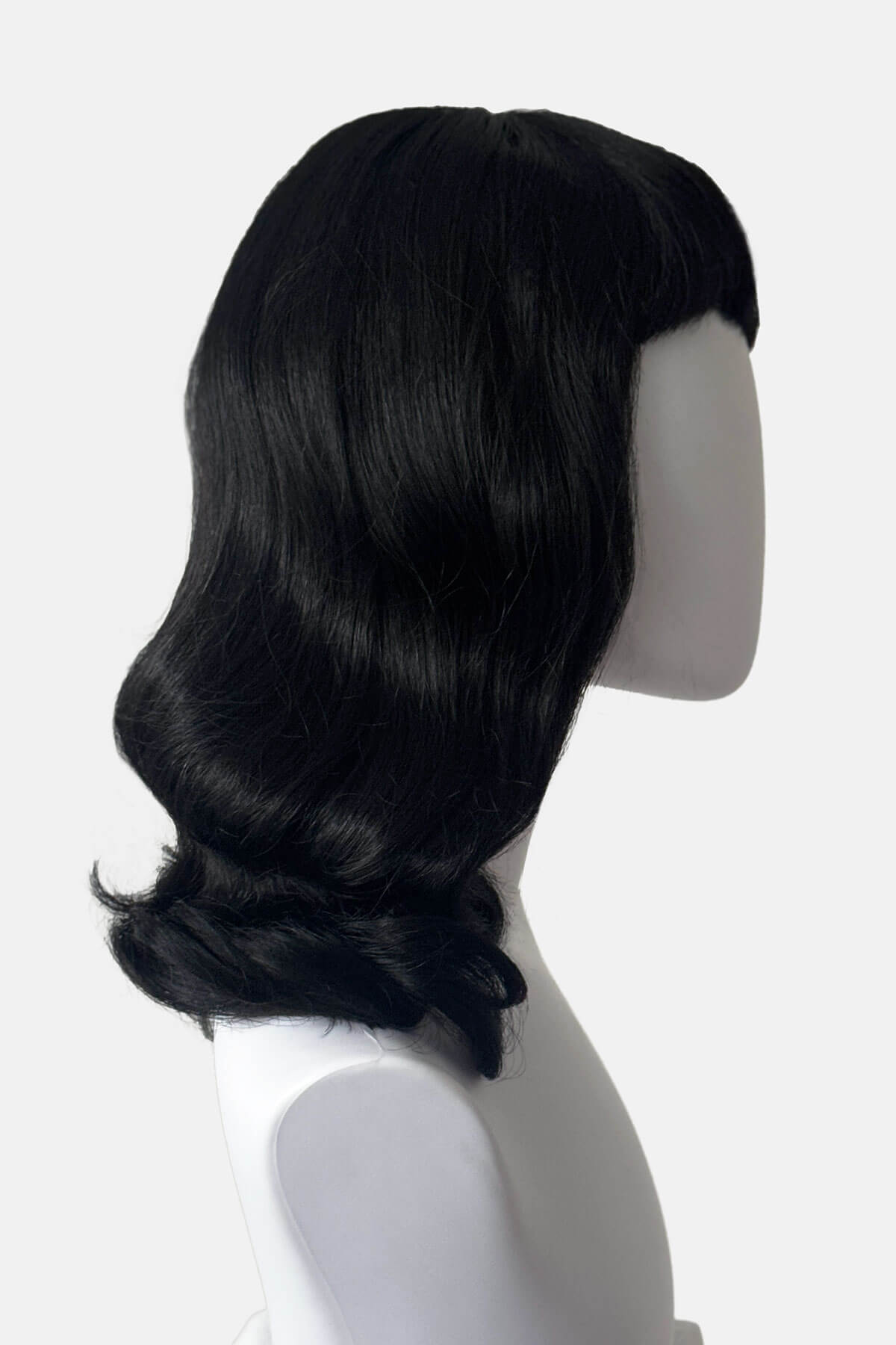 Mannequin with shoulder length, black wavy wig. Black pin-up style wig, curled with short fringe: Bettie