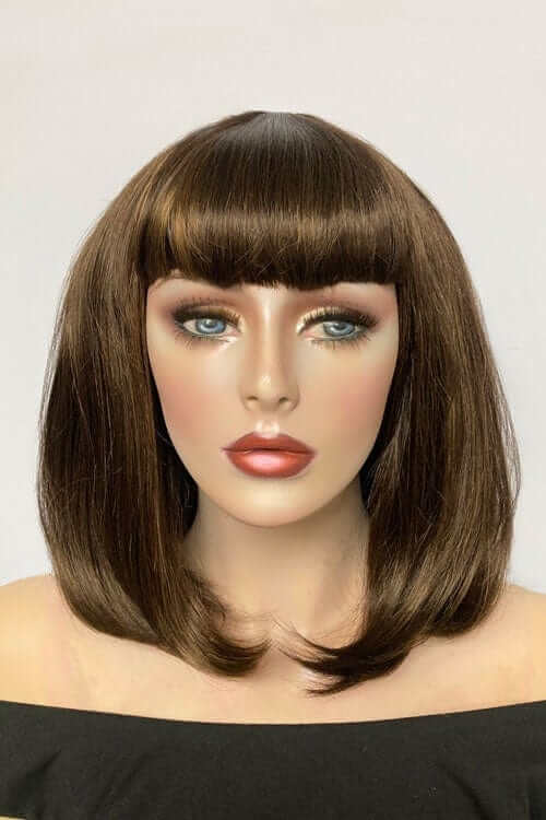 Mannequin head with brown wig and bangs on a plain background. Long bob wig with a short fringe, brown with blonde highlights: Jill