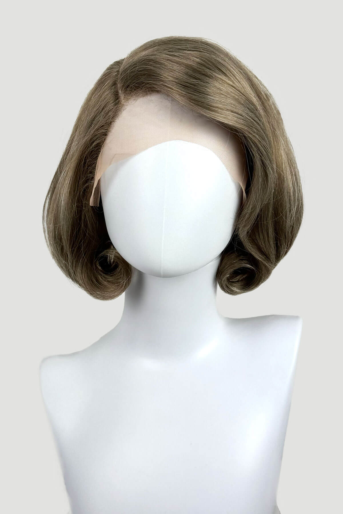 Mannequin head with a brown wig on a plain background. Dark golden wig, lace front, rockabilly style with victory rolls: Bobbie